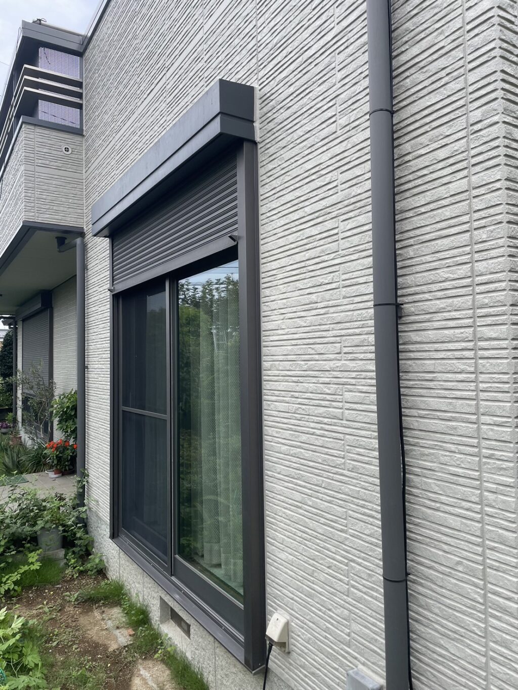 文化製車庫電動シャッターの内蔵電動スプリングシャフト交換の修理事例